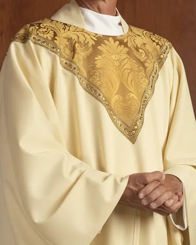 Ecclesiastical vestment with intricate gold embroidery on a plain background