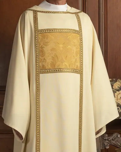 Ecclesiastical vestment with gold embroidery on a wooden background