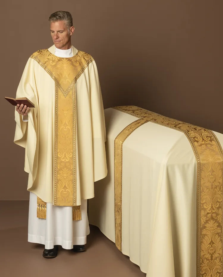 Priest in liturgical vestments standing next to an altar with a brown background